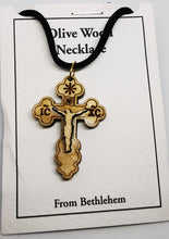 Load image into Gallery viewer, Handmade in Bethlehem olive wood crucifix pendant with black cord in packaging