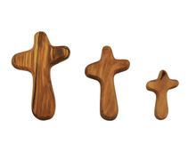 Load image into Gallery viewer, Hand carved olive wood holding cross, small medium and large, made in Bethlehem. Unique grain, fits in palm of hand
