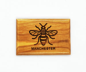 Rectangular olive wood magnet with bee and MANCHESTER lasered on