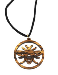 Manchester bee olive wood necklace, made in Bethlehem. Hung on black cord
