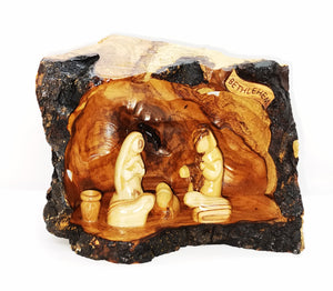hand crafted nativity grotto, made in Bethlehem. faceless figures of Mary, Joseph, baby Jesus and lambs