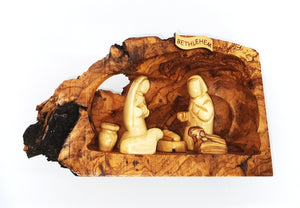 hand crafted nativity grotto, made in Bethlehem. faceless figures of Mary, Joseph, baby Jesus and lambs