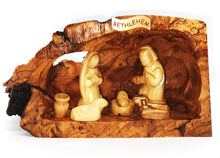 Load image into Gallery viewer, hand crafted nativity grotto, made in Bethlehem. faceless figures of Mary, Joseph, baby Jesus and lambs
