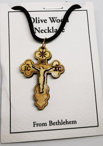Handmade in Bethlehem olive wood crucifix pendant with black cord in packaging