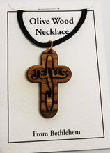 Load image into Gallery viewer, Handmade in Bethlehem olive wood Jesus cross pendant with black cord in packaging
