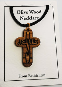 Handmade in Bethlehem olive wood Jesus cross pendant with black cord in packaging