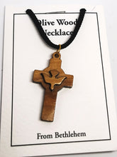 Load image into Gallery viewer, Handmade in Bethlehem olive wood cross with dove pendant with black cord in packaging 
