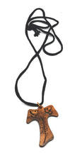 Load image into Gallery viewer, Handmade in Bethlehem, olive wood cross pendant with olive branch and two doves with black cord
