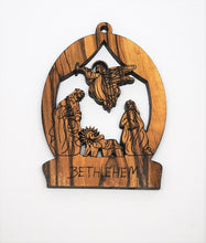 Load image into Gallery viewer, 2D olive wood Christmas decoration. Angel visiting Mary, Joseph and baby Jesus. Made in Bethlehem 
