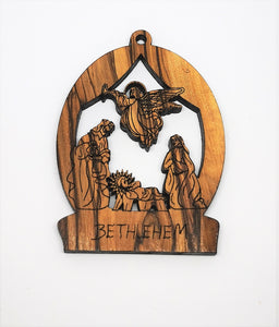 2D olive wood Christmas decoration. Angel visiting Mary, Joseph and baby Jesus. Made in Bethlehem 