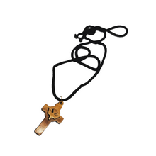 Load image into Gallery viewer, Handmade in Bethlehem olive wood cross with dove pendant with black cord
