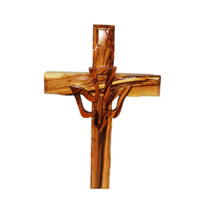 Hand carved olive wood cross with hand made wooden dove outline attached to the middle 