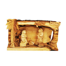 Load image into Gallery viewer, Hollowed out olive wood branch, hand carved in Bethlehem to create nativity scene. Faceless figures of Mary, Joseph, Baby Jesus and lambs. Palm tree, star of Bethlehem, natural unique grain
