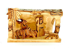 Load image into Gallery viewer, Hollowed out olive wood branch, hand carved in Bethlehem to create nativity scene. Figures of Mary, Joseph, Baby Jesus and lambs. Palm tree, star of Bethlehem, natural unique grain
