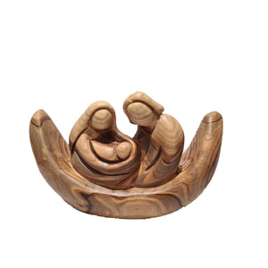 family in boat hand made in Bethlehem from olive wood